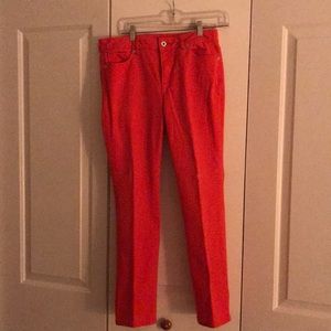 Orange jeans. Front zipper, side and back pockets.